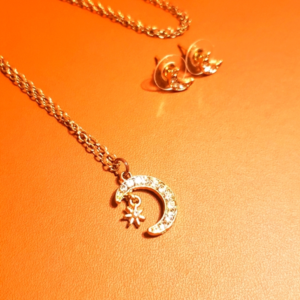 Gold necklace with moon and start pendant and matching earrings set